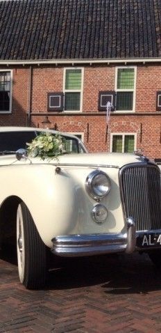 Oldtimer-verhuur Jag Tax Trouwauto's